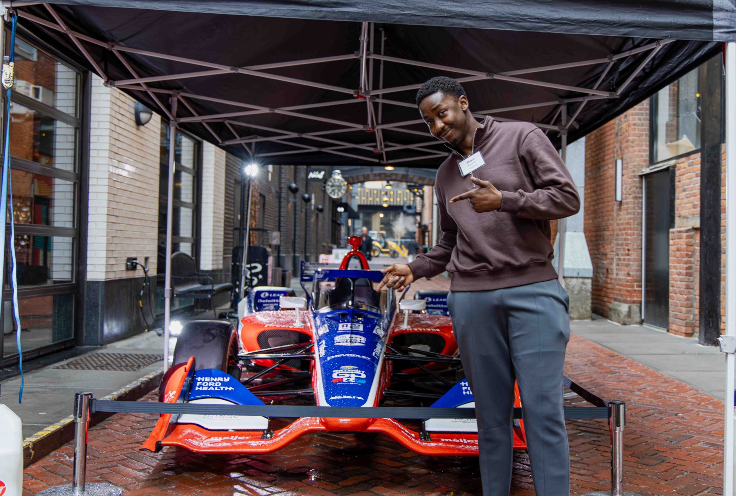 KARMA jack's Shawn in Parker's Alley near the Brakeman in front of the Team Penske IndyCar