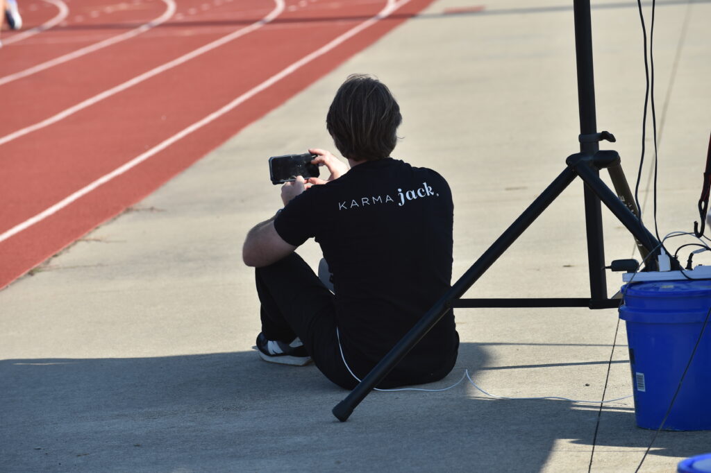 Joel taking phone pictures at Golden Grizzlies Festival of Races