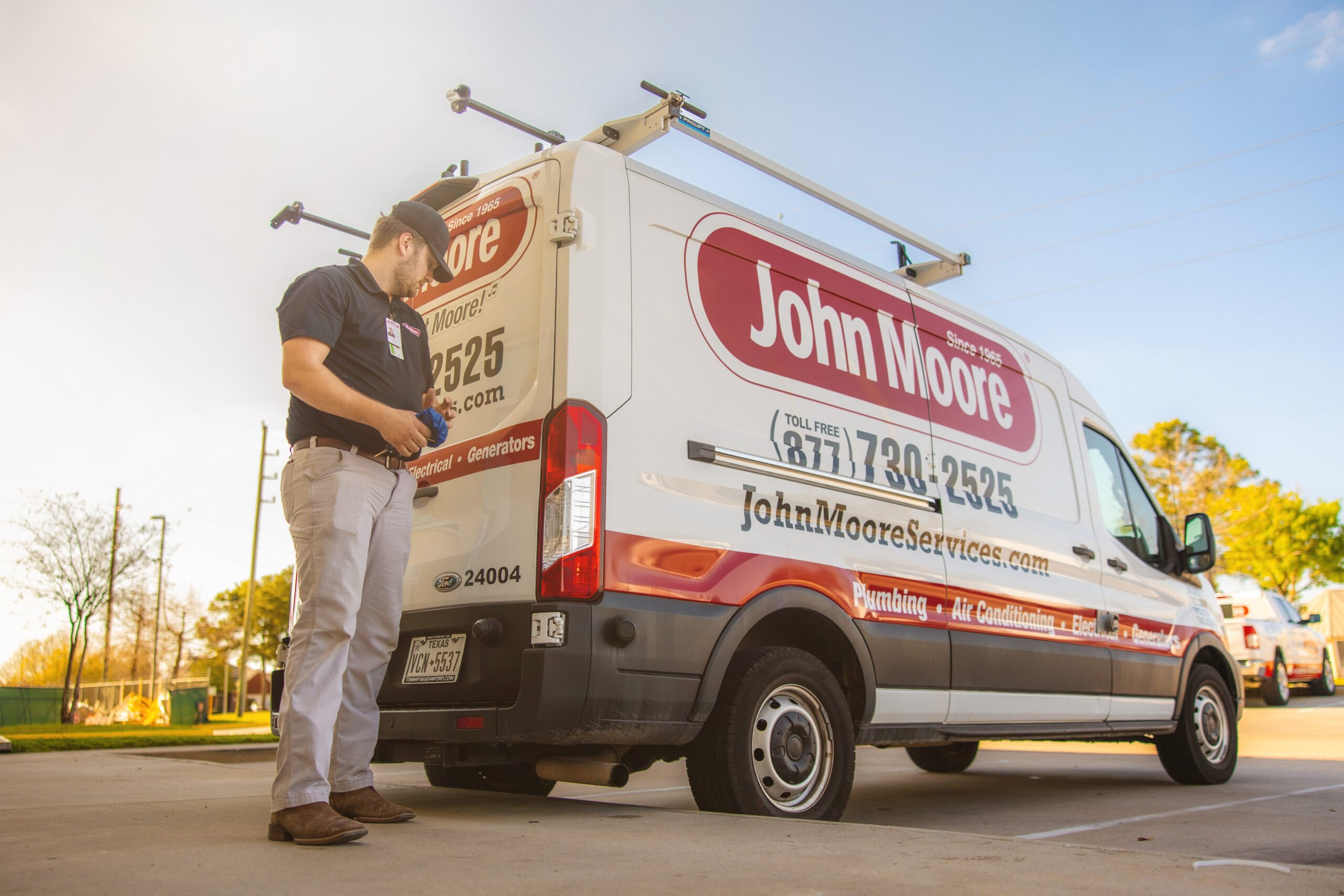 JMS team member with van